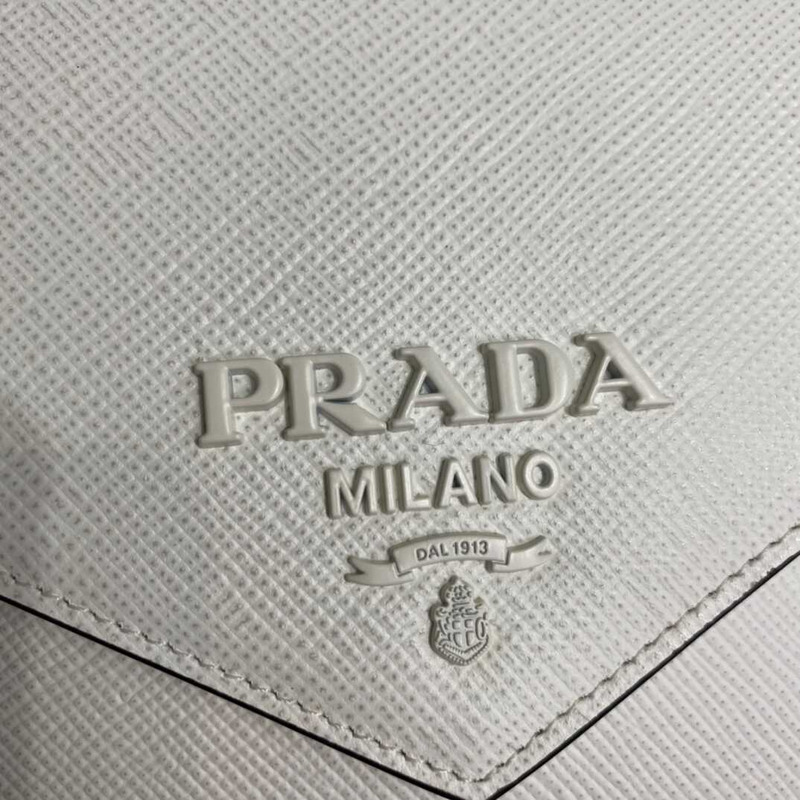 pra*a monoCh*0me saffiano leather bag white