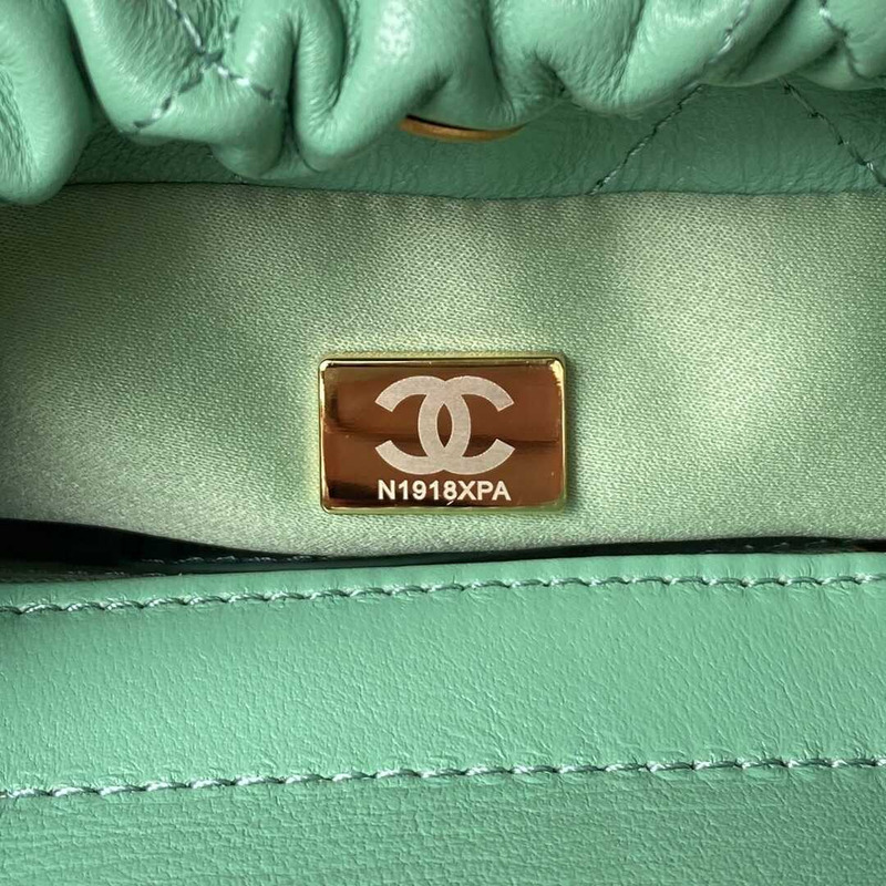 Ch*el small bucket bag lambskin resin & gold-tone metal light green